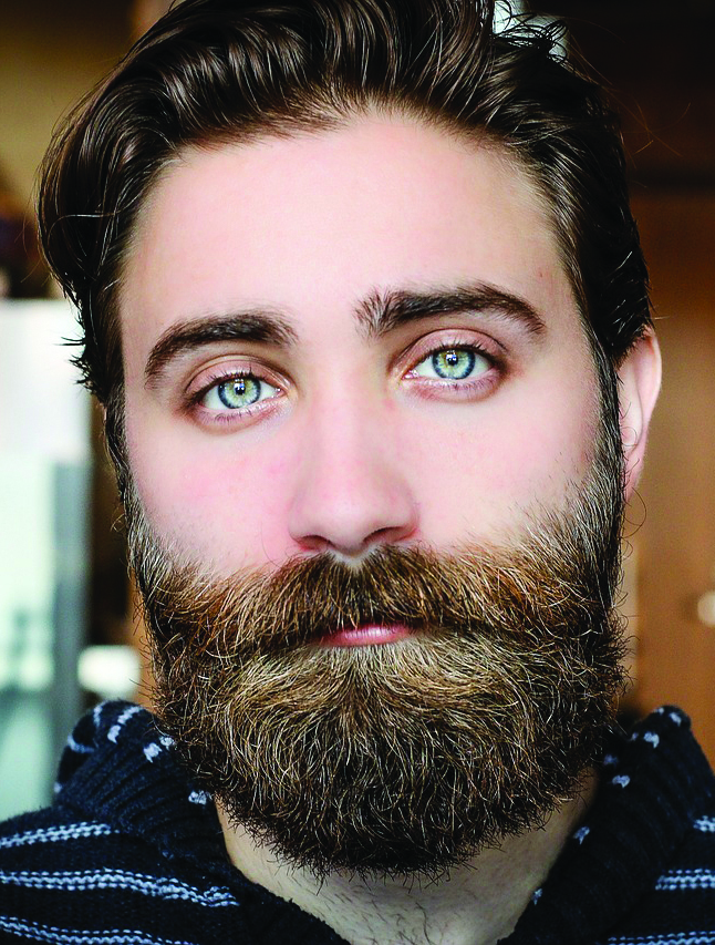 A dark-haired man with a beard