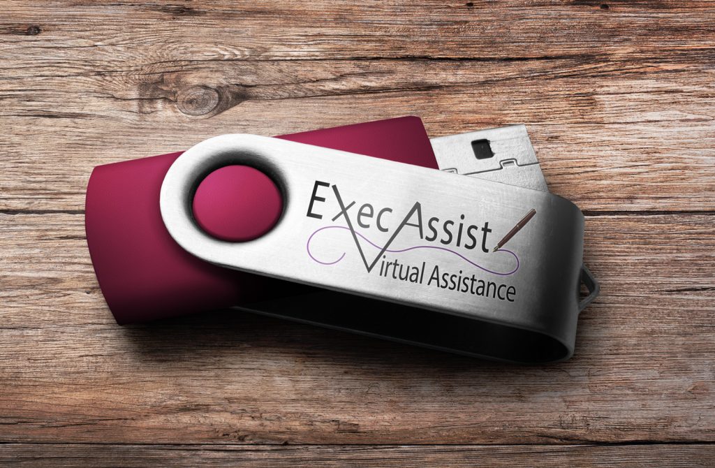 ExecAssist LLC logo on a flash drive